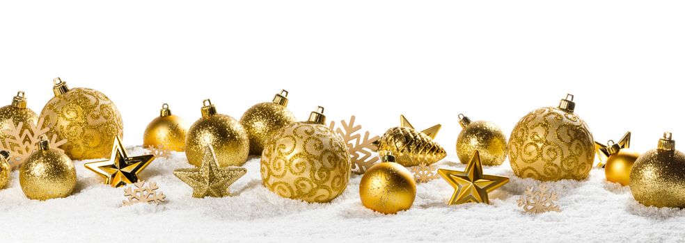 Christmas border with golden ornaments on snow isolated on white background