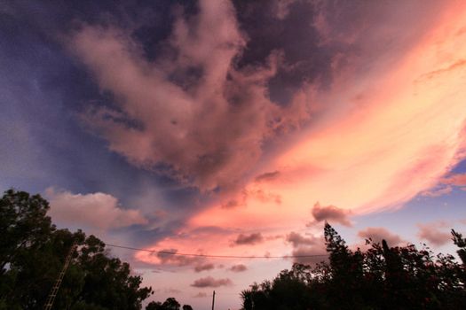 Pink Clouds and lovely sky at Sunset in Alicante in summer