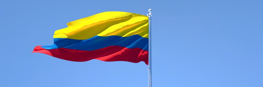 3D rendering of the national flag of Colombia waving in the wind against a blue sky