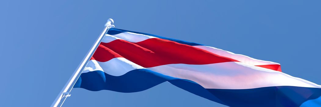 3D rendering of the national flag of Costa Rica waving in the wind against a blue sky