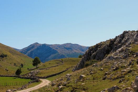 A mountain road that leads to the mountain tops. Beautiful landscape on the mountain in autumn. Bjelasnica Mountain, Bosnia and Herzegovina.