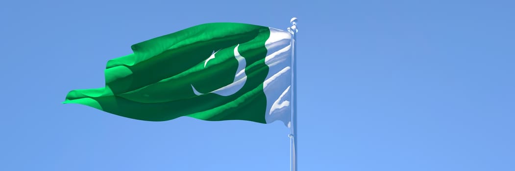 3D rendering of the national flag of Pakistan waving in the wind against a blue sky