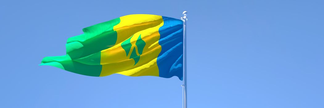 3D rendering of the national flag of Saint Vincent and the Grenadines waving in the wind against a blue sky