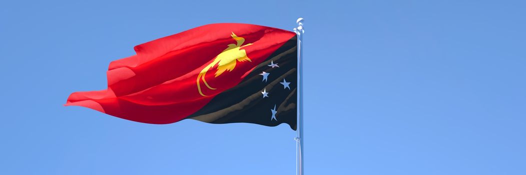 3D rendering of the national flag of Papua new Guinea waving in the wind against a blue sky