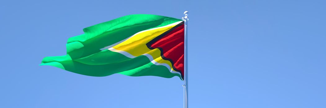 3D rendering of the national flag of Guyana waving in the wind against a blue sky