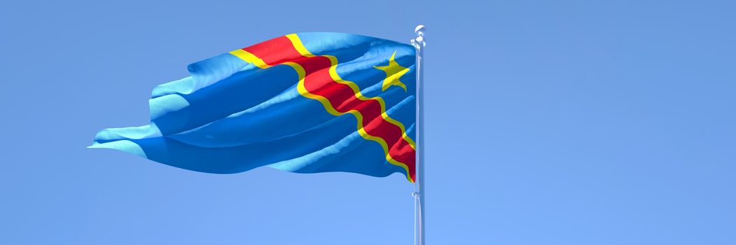 3D rendering of the national flag of Congo waving in the wind against a blue sky