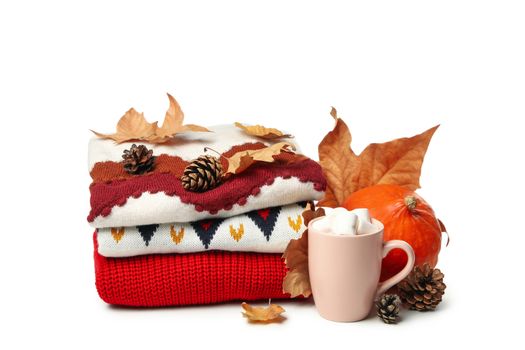 Autumn concept with sweater and cup of coffee isolated on white background