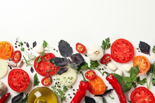 Different herbs and spices on white background, top view