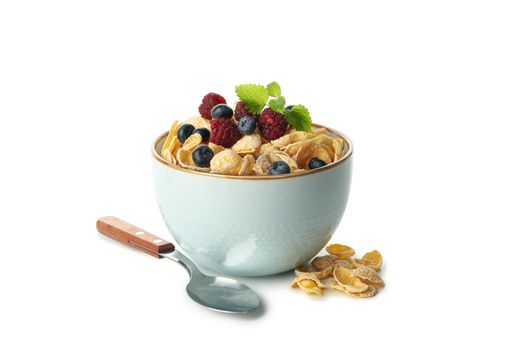 Spoon and bowl with muesli and berry isolated on white background