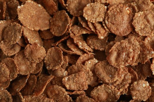 Tasty chocolate muesli on whole background, close up