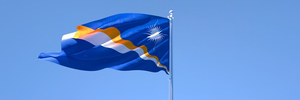 3D rendering of the national flag of Marshall Islands waving in the wind against a blue sky