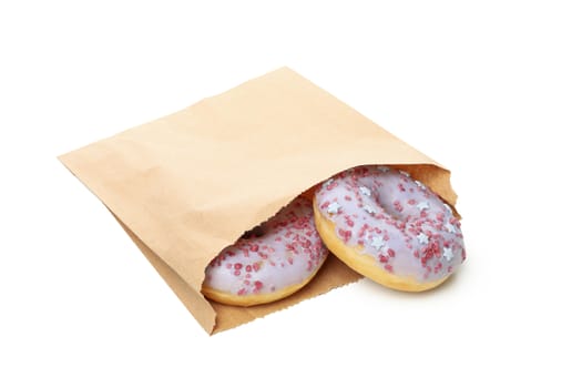 Paper bag with donuts isolated on white background