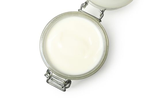 Glass jar of sour cream yogurt isolated on white background