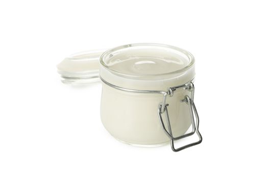 Glass jar of sour cream yogurt isolated on white background
