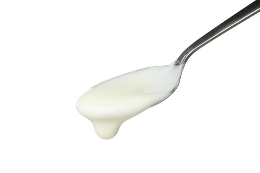 Spoon with sour cream yogurt isolated on white background