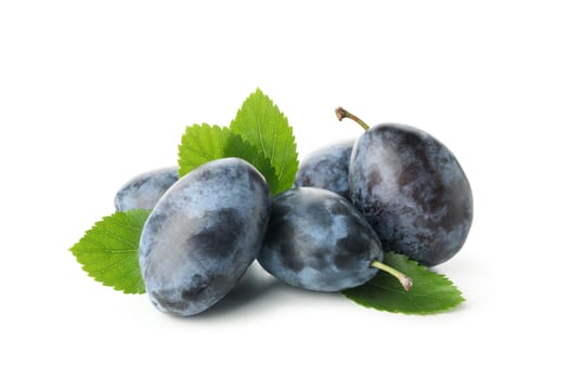 Plums and leaves isolated on white background