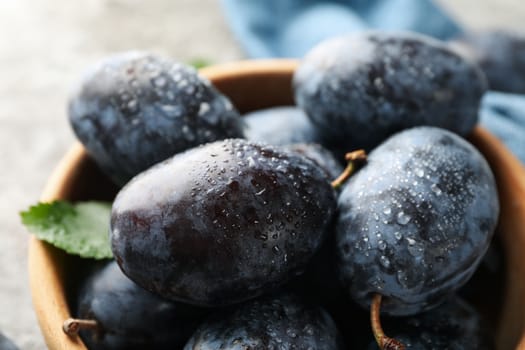 Fresh plums with water drops, close up