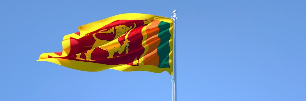 3D rendering of the national flag of Sri Lanka waving in the wind against a blue sky
