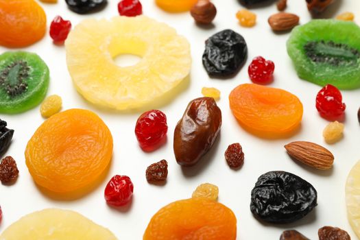 Tasty dried fruits on white background, close up