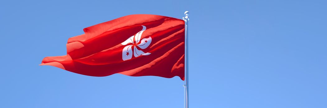 3D rendering of the national flag of Hong Kong waving in the wind against a blue sky