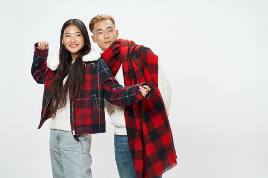 Fashionable teenagers in warm clothes checkered jacket isolated background