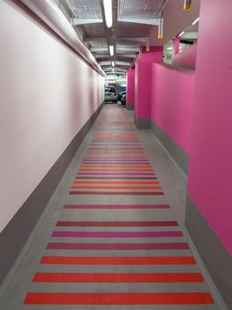 Pink modern passageway in an underground parking garage