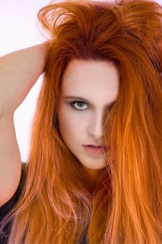 pretty girl with very long orange hair and green eyes. heavy makeup and clean face. Model with pretty face