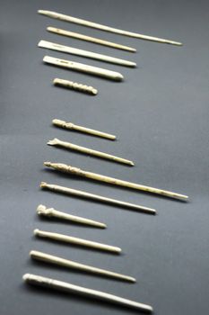 Alicante, Spain- October 8, 2020: Roman bone needles to hold hair of the 1st and 2nd century exhibited at the Archaeological Museum of Alicante