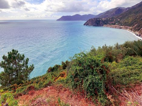 Cinque Terre, Italy - 09/02/2020: Beautiful landscape of a coastal fishing village, amazing view on many little colorful houses, traditional architecture of the little Italian town called Cinque Terre