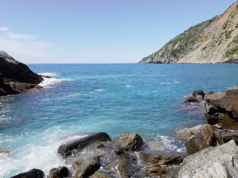 Cinque Terre, Italy - 09/02/2020: Beautiful landscape of a coastal fishing village, amazing view on many little colorful houses, traditional architecture of the little Italian town called Cinque Terre