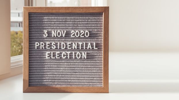 Announcement of USA Presidential Election at 3rd November 2020. Call to go to the vote. Letter board on white window sill. Copy space.