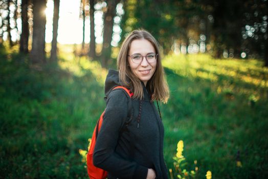 Healthy lifestyle woman walking in mountains in summer forest area