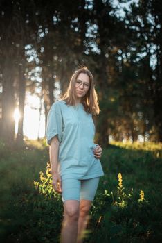 Healthy lifestyle woman walking in mountains in summer forest area