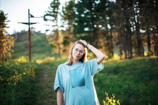 Healthy lifestyle woman walking in mountains in summer forest area