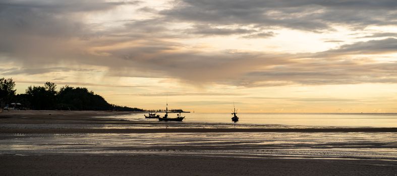 Beautiful sunrise on the beach with cloud sky in the morning.