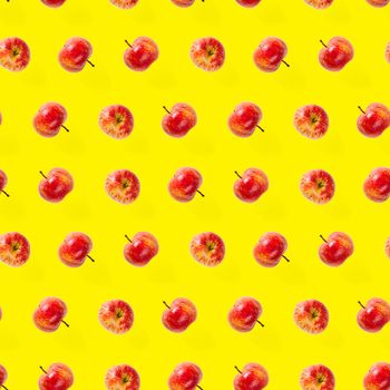 Seamless pattern with ripe apples. Apple seamless pattern on yellow background. Tropical fruit abstract background.