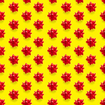 Seamless regular creative Christmas pattern with New Year decorations on yellow background. xmas Modern Seamless pattern made from christmas decorations. Photo quality pattern for fabric, prints, wallpapers, banners or creative design works.