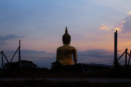 Buddha with silhouette at the sunrise.