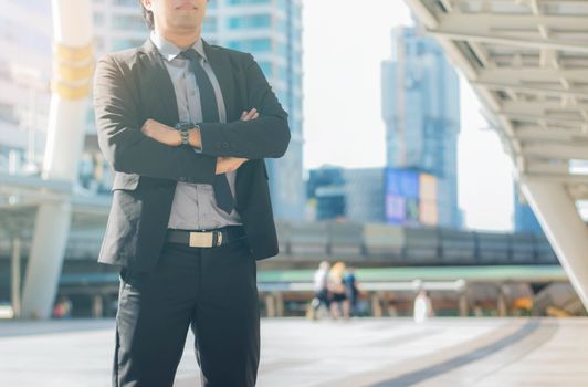 businessman stands in the city with landmark.