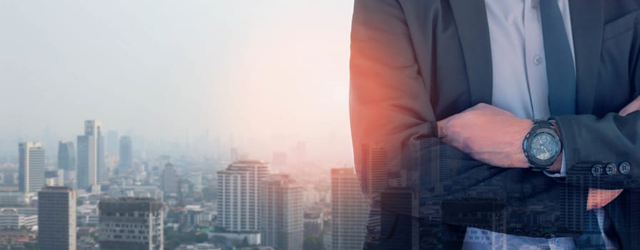 Businessman grinning against the capital background.