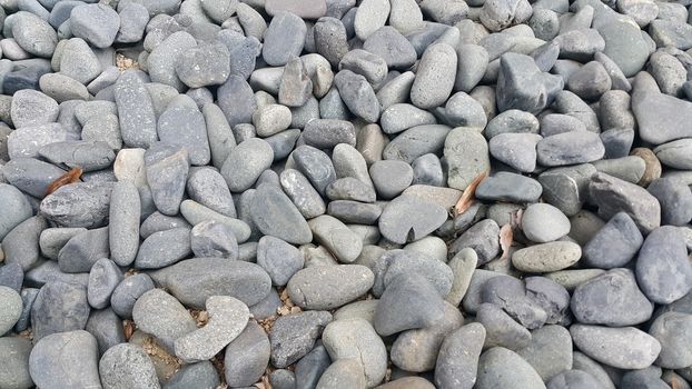 Texture background: Rock Pebbles, small, rounded, smooth pibbles with copy space for text