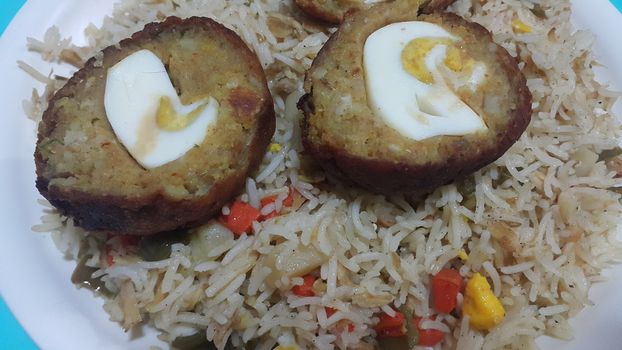 Top view of meat balls or meat kofta curry in Basmati rice pulao or pulav or vegetable rice dish