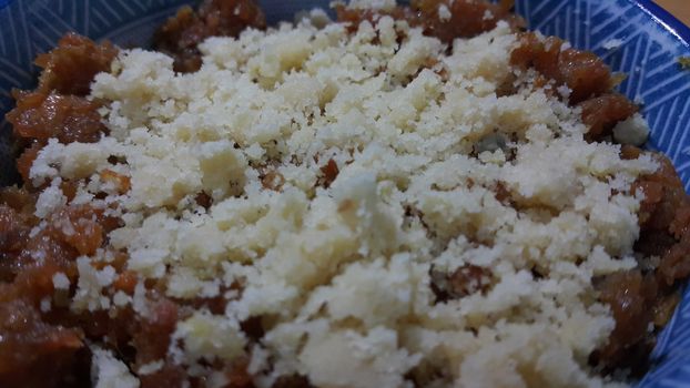 Closeup view of traditional  tasty sweet dessert called Suji Halwa or Halva, made of Semolina at home in south Asian countries with different dry fruit ingredients