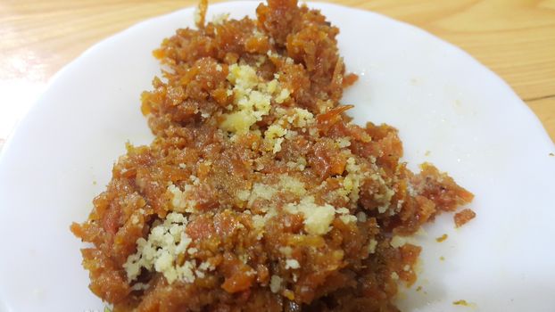 Closeup view of traditional  tasty sweet dessert called Suji Halwa or Halva, made of Semolina at home in south Asian countries with different dry fruit ingredients.