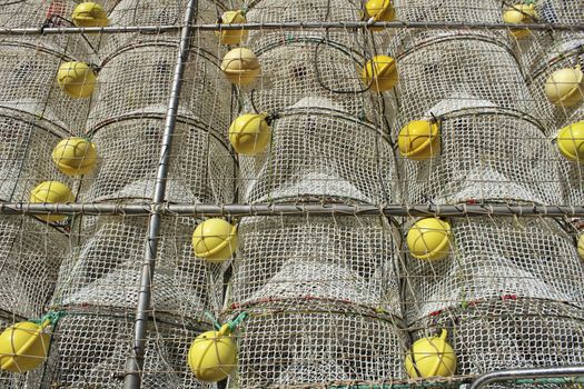 Cages to catch seafood stacked in the port of Santa Pola, Alicante Spain