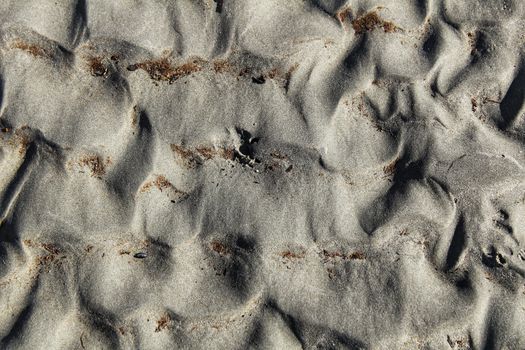 Textures on the beach sand in a sunny day