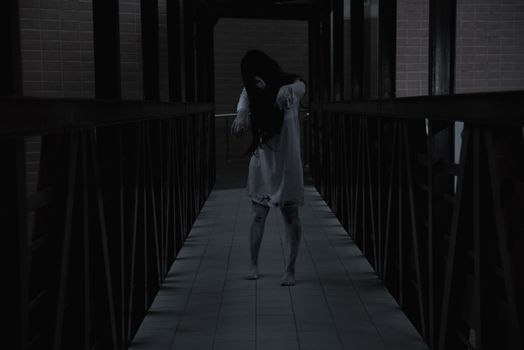 Woman ghost horror walking in the building house, halloween concept