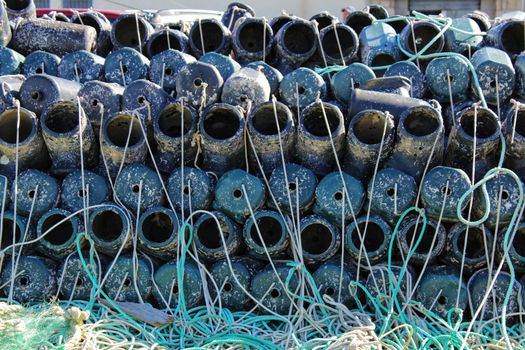 Traps to fish octopus and nets in the pier of Santa Pola, Spain