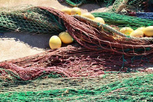 Fishing nets background and colorful buoys in the port of Santa Pola, Alicante