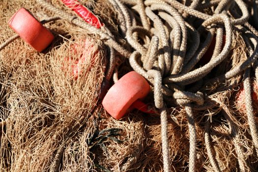 Fishing nets background and colorful buoys in the port of Santa Pola, Alicante